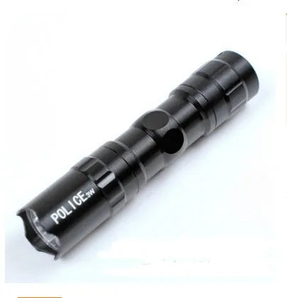 Black aluminium LED mini flashlight showing compact size with measurement scale
