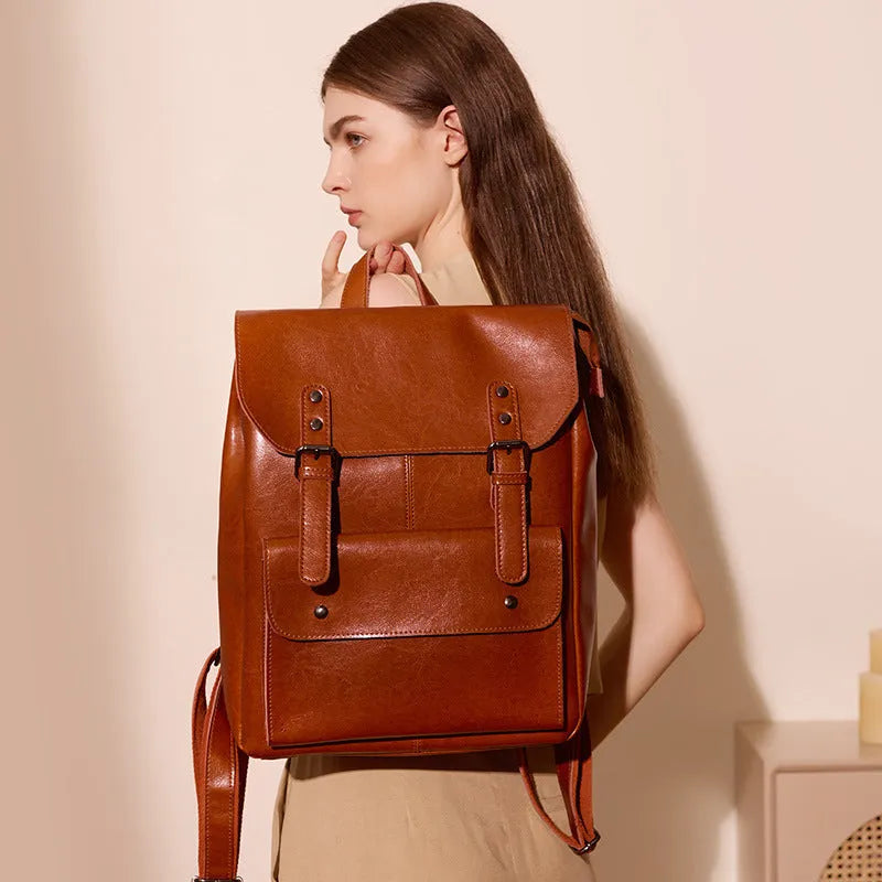Genuine leather cowhide backpack with hard texture construction and internal lining for laptop organisation