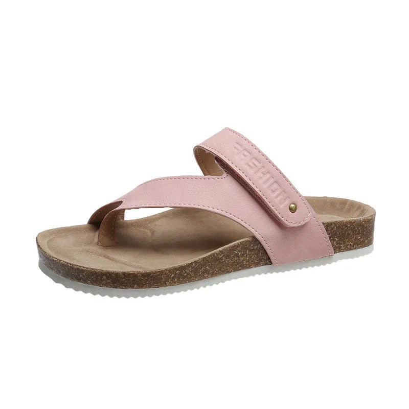 Blue thick-soled flip-flops with a flat toe ring on a light background