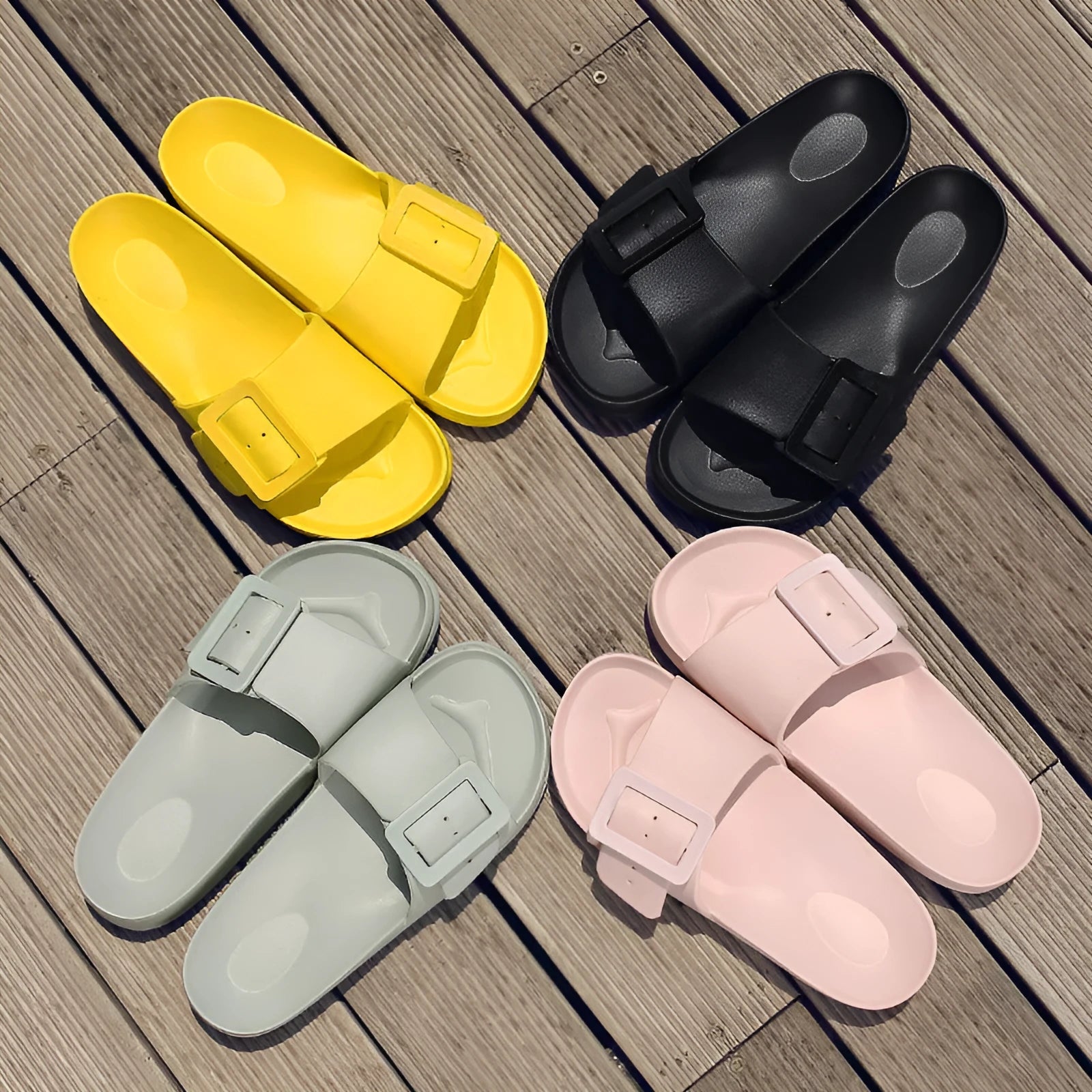 Women's grey blue EVA buckle slipper sandals on a white background.