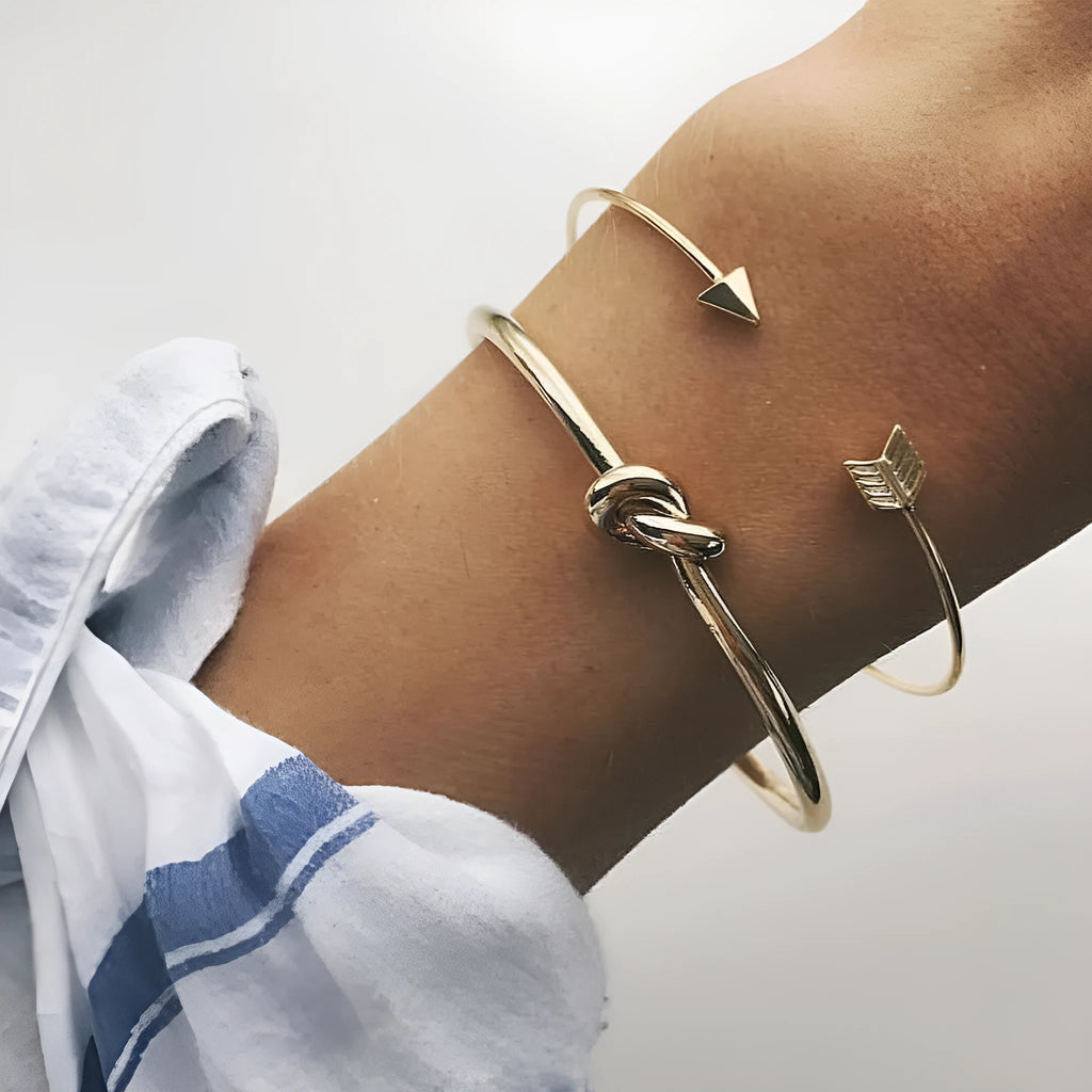 Women's gold vintage cuff bracelet with knotted arrow design in electroplated alloy