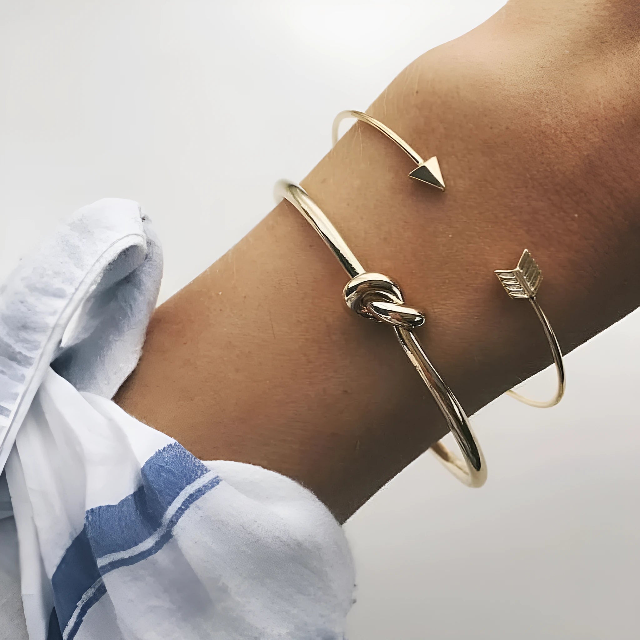Women's gold vintage cuff bracelet with knotted arrow design in electroplated alloy