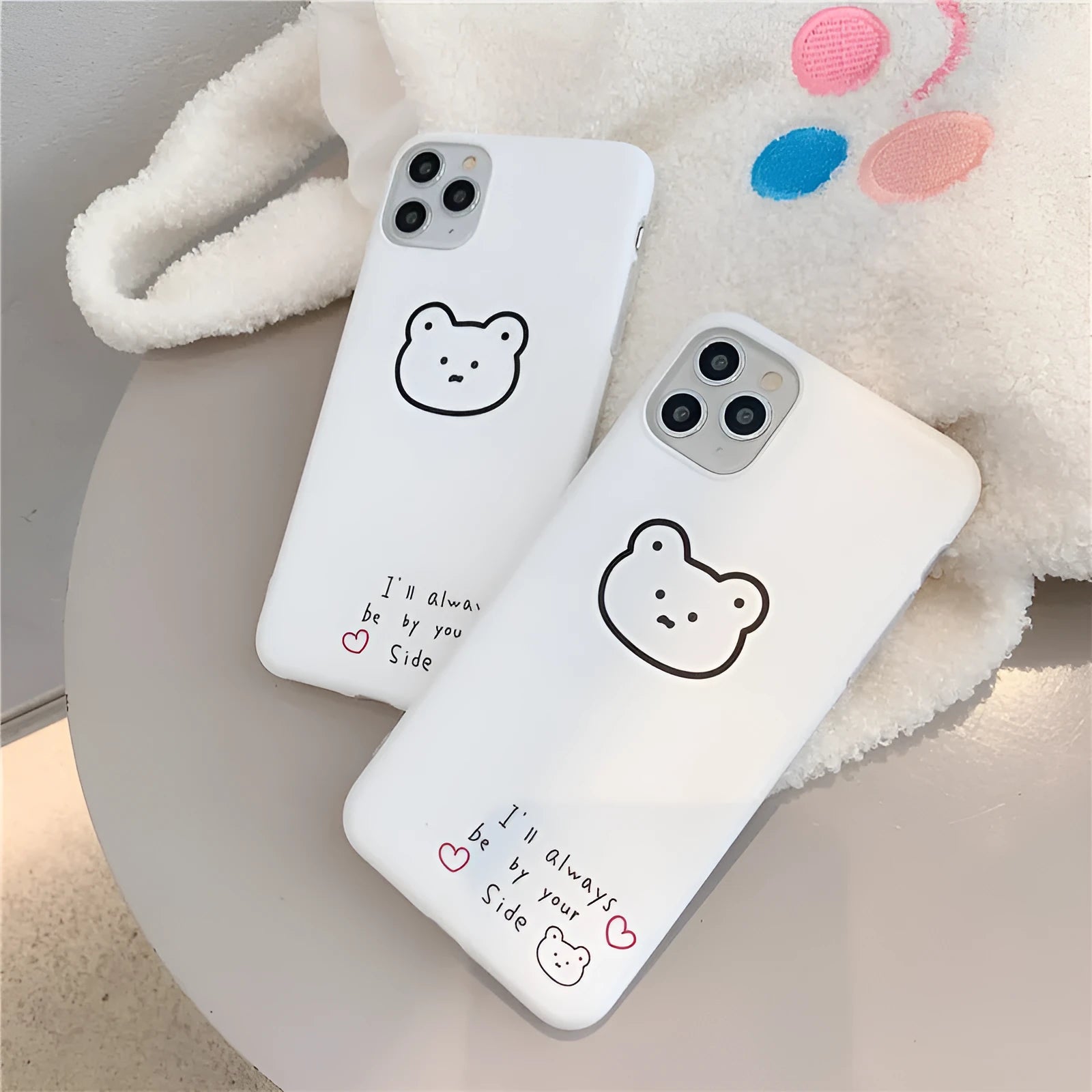 Silicone mobile phone case with a cartoon bear design for Apple iPhone models.