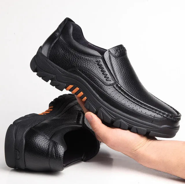 Black and brown business casual slip-on leather shoes with a rubber sole.