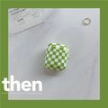 Black and green checkerboard pattern TPU protective case covers for Apple AirPods, one with a smiley face lanyard.