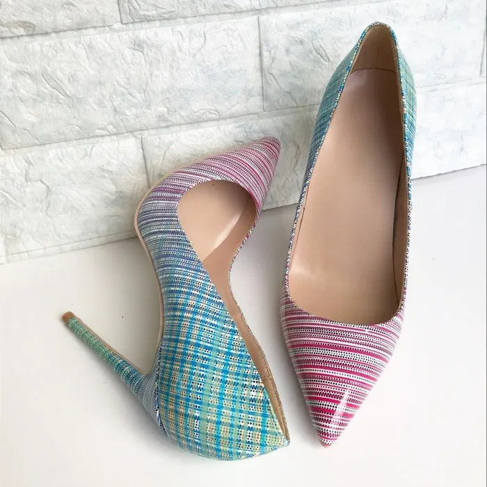 Ladies' pink and blue gradient patent leather pointed toe stiletto heels on a white background.