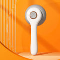 Blue and white self-cleaning pet grooming slicker brush with massage function for cats and dogs.