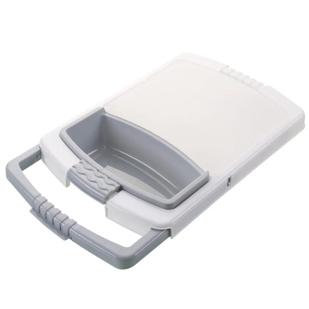 Green kitchen drain cutting board with drainage holes and storage trough mounted on a sink