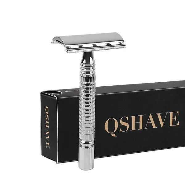 Chrome double edged safety razor with butterfly opening mechanism on a storage box