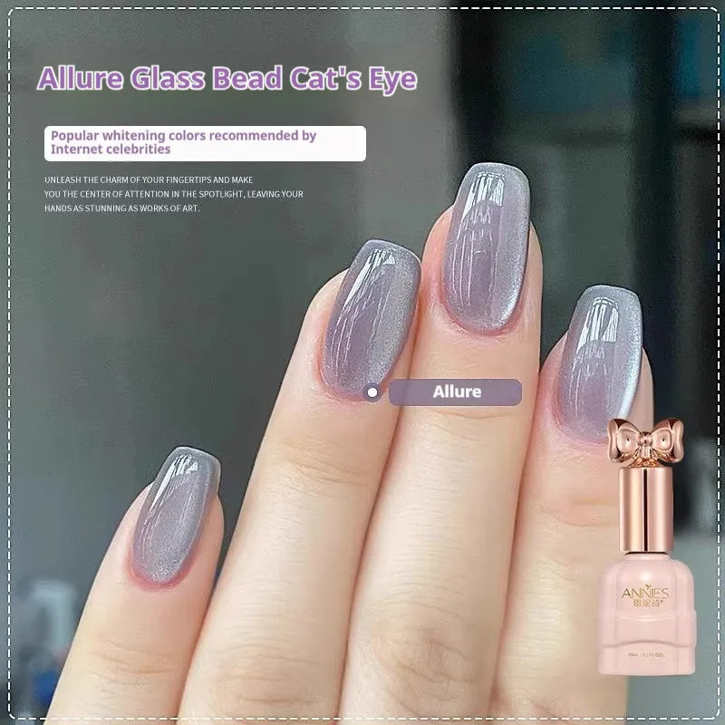 Bottle of micro glass bead cat eye gel nail polish showing magnetic shimmer effect on a nail swatch.