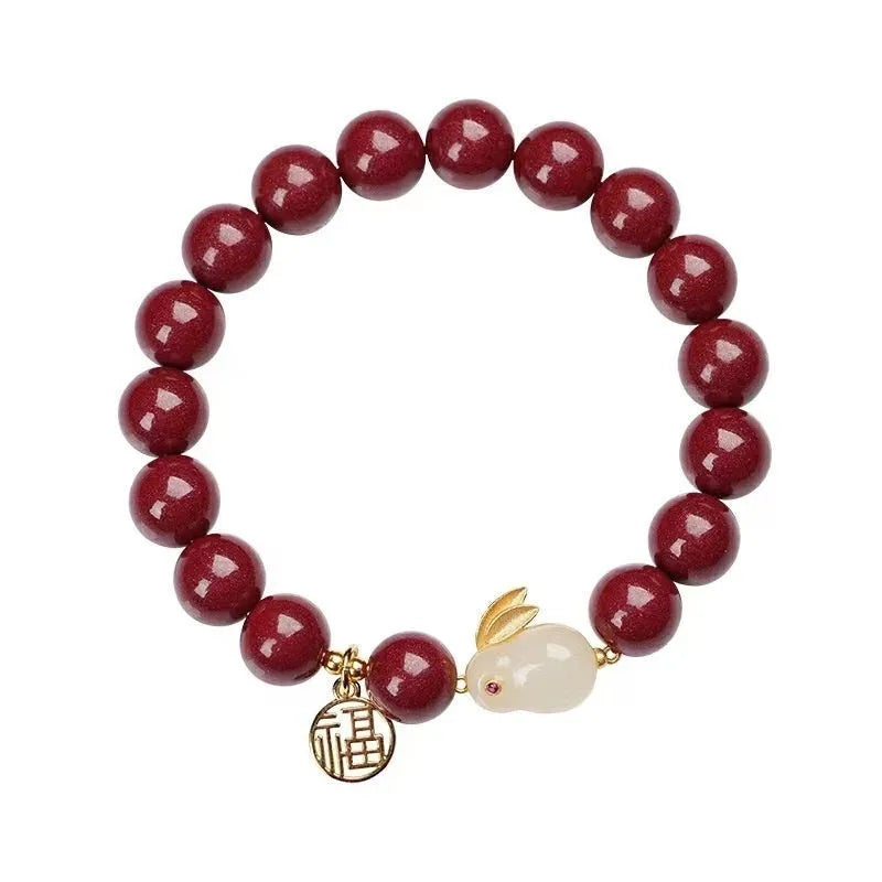 Cinnabar hare bracelet in purple gold sand colour with traditional bead design