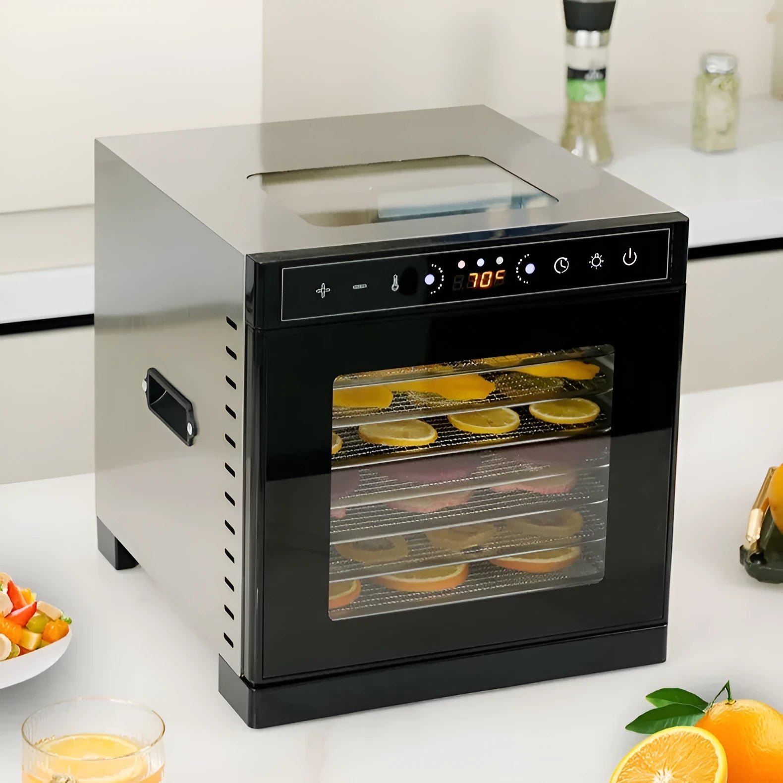 Stainless steel fruit dehydrator machine with multiple mesh trays and an LED control panel.