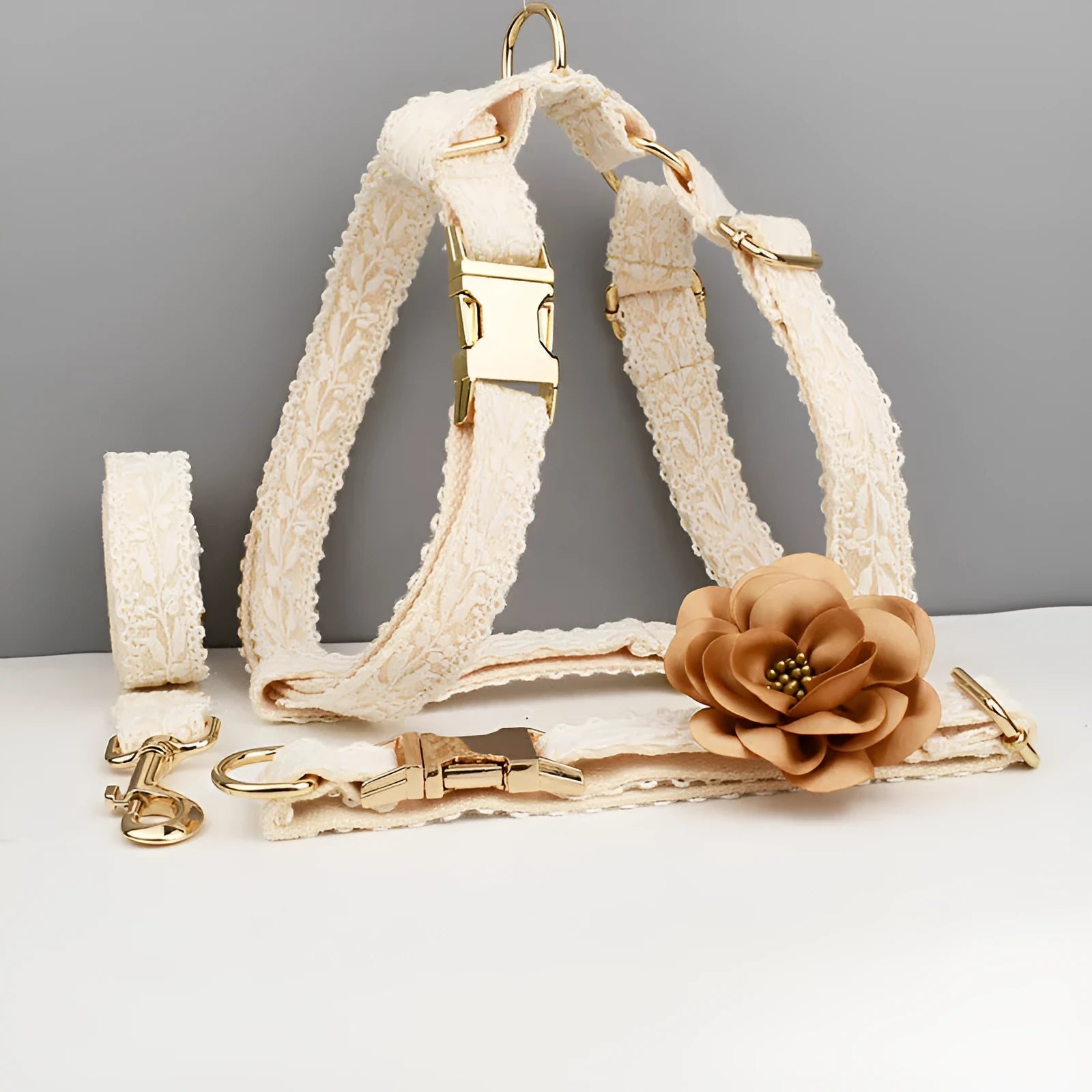 Four-piece dog wedding accessory set with lace collar vest, matching leash, and decorative flowers