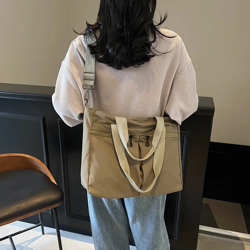 Large capacity solid colour messenger bag in Oxford cloth with 36-55L storage