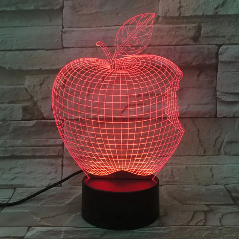 3D fruit-shaped colourful night light with acrylic shade and touch control on a surface.