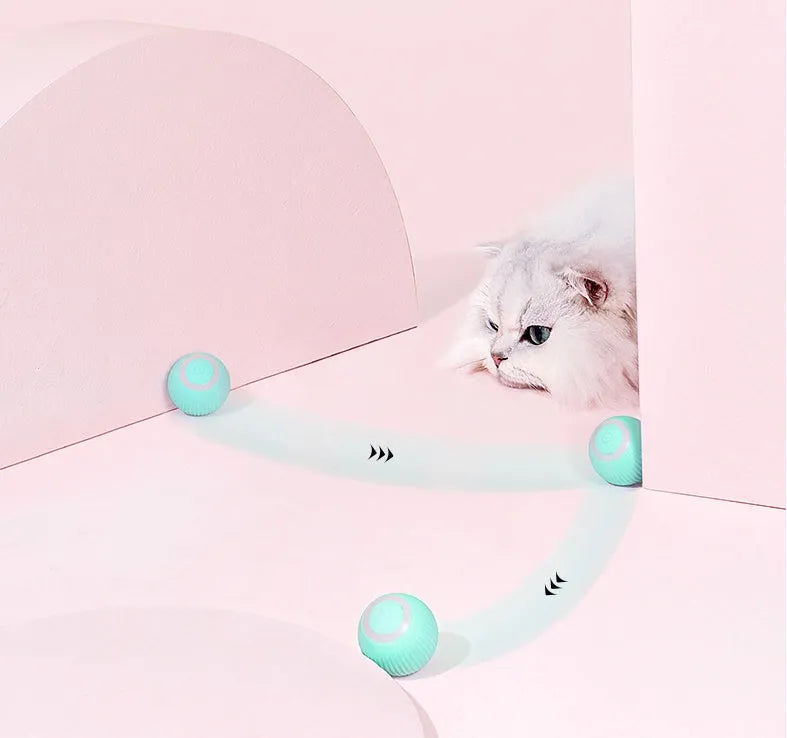 Green or pink 43mm automatic rolling ball cat toy with intelligent obstacle avoidance on a hard floor