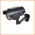 Black plastic solar simulation gun camera dummy security unit with flashing LED light