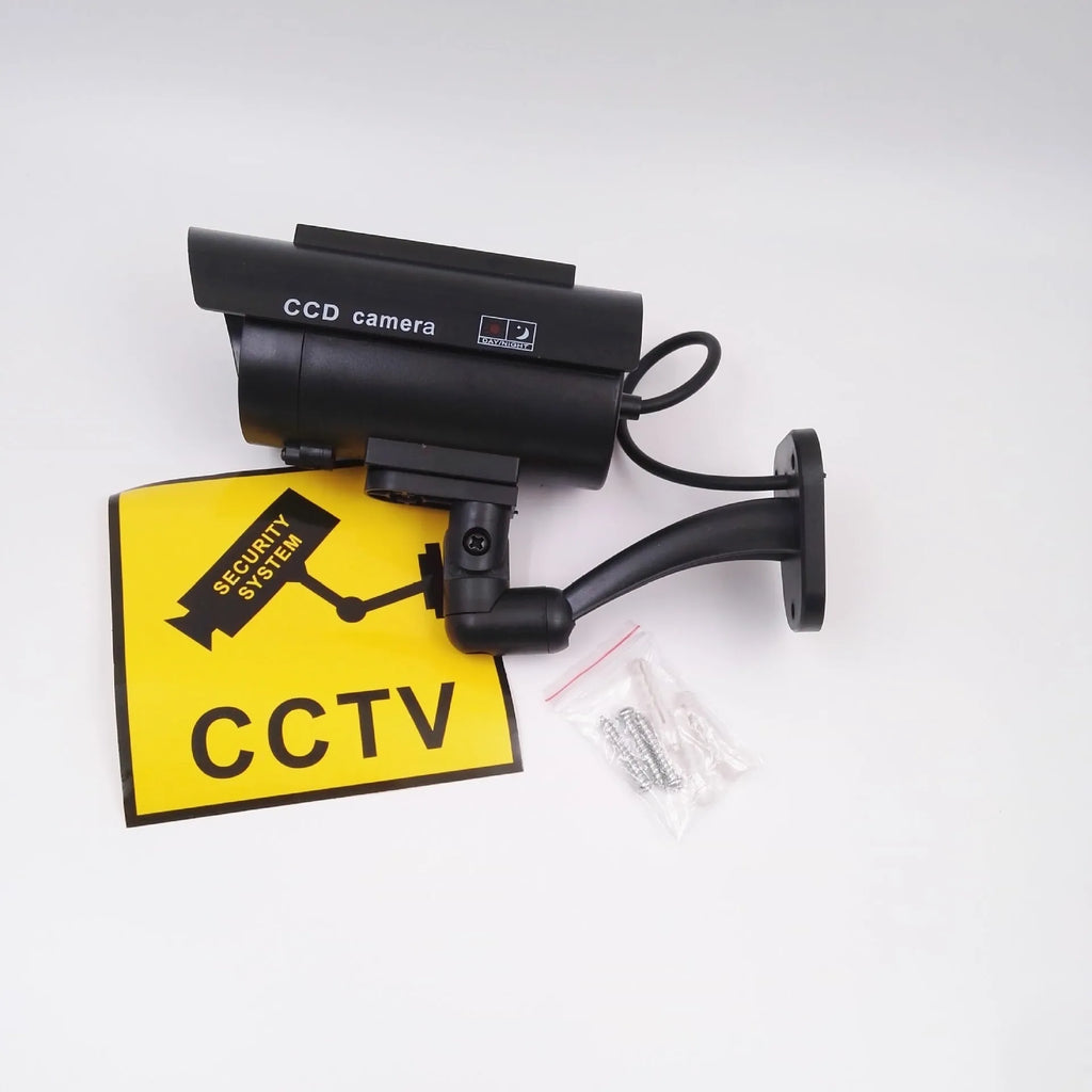 Black plastic solar simulation gun camera dummy security unit with flashing LED light