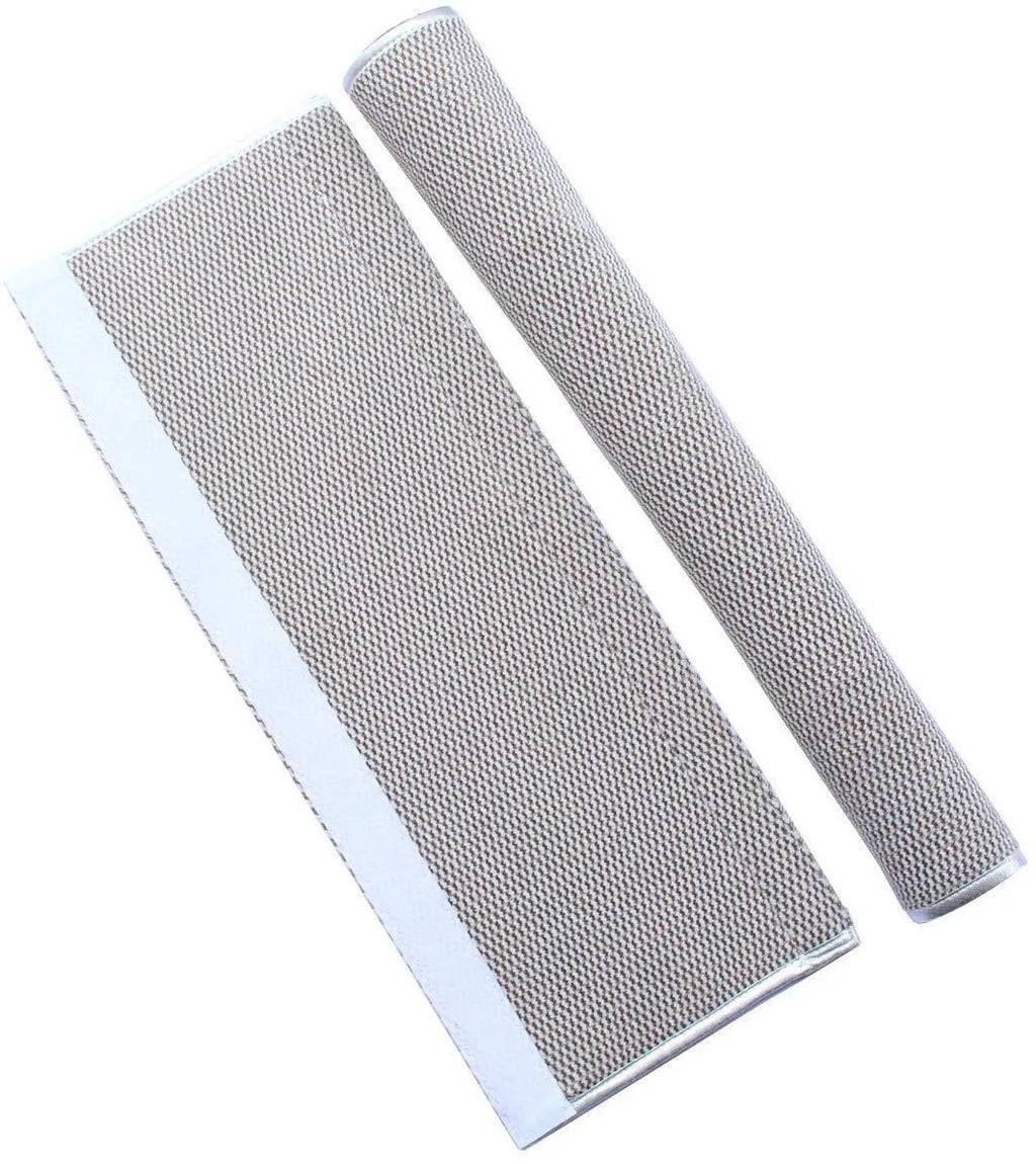 Grey solar-powered outdoor wall light mounted on a garden fence, showing its solar panel and LED light source.
