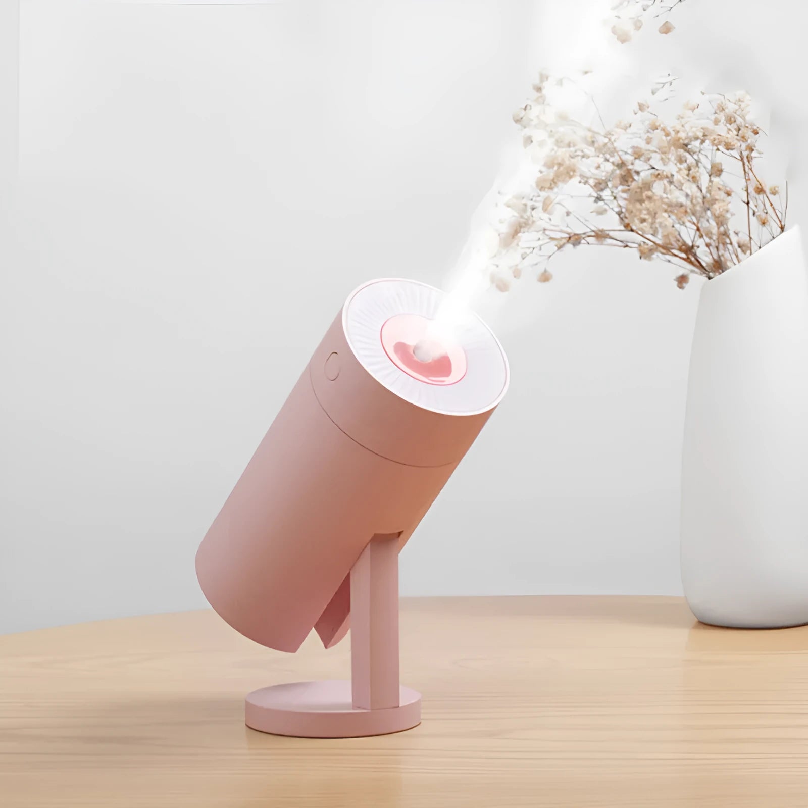 Compact white folding bracket USB desktop humidifier on a wooden desk