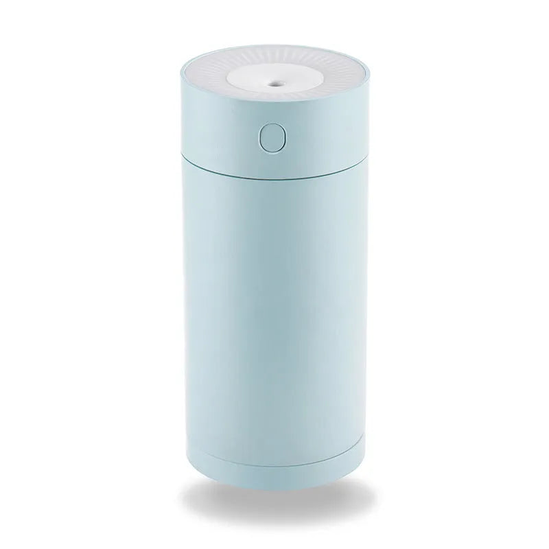Compact white folding bracket USB desktop humidifier on a wooden desk