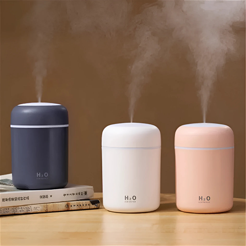 Pink car USB air purifying humidifier with 300ml water tank on car dashboard
