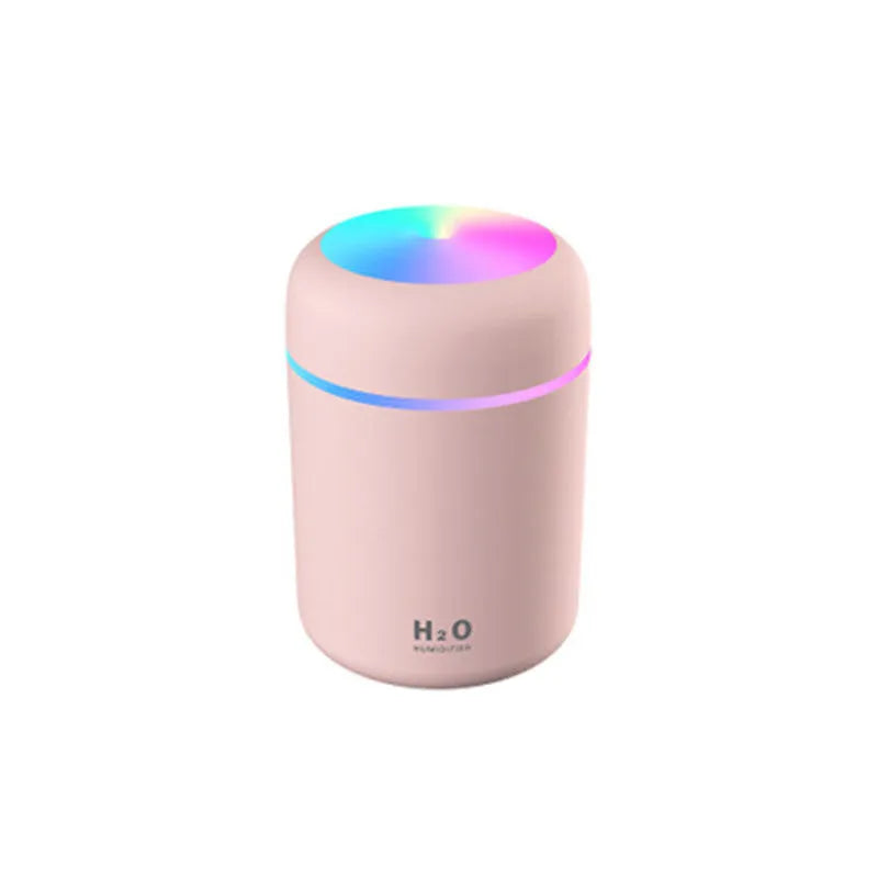 Pink car USB air purifying humidifier with 300ml water tank on car dashboard
