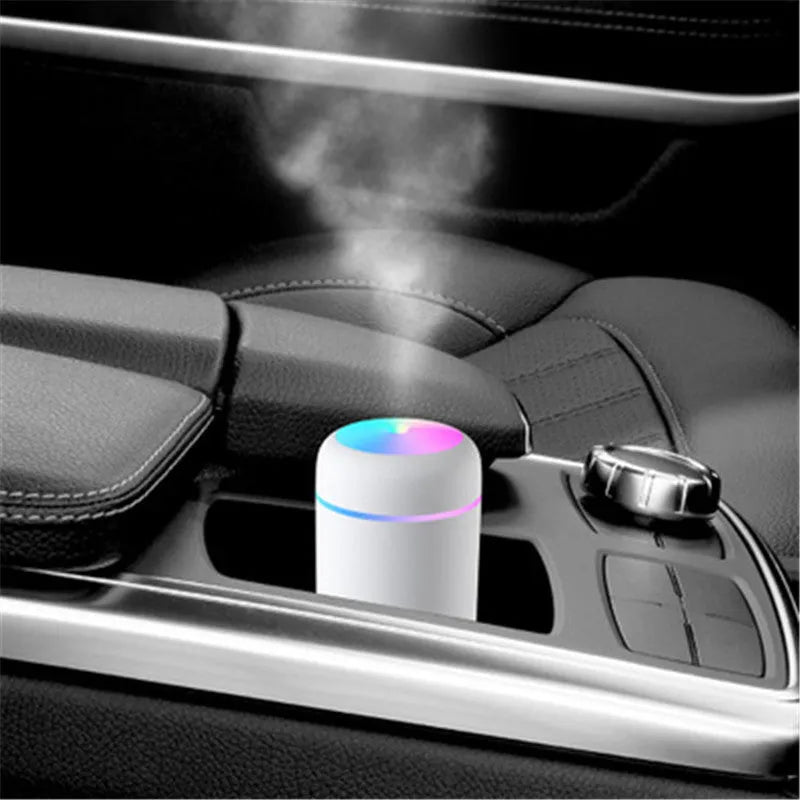 Pink car USB air purifying humidifier with 300ml water tank on car dashboard