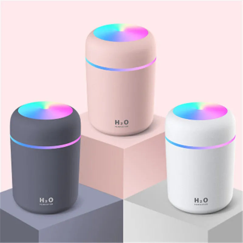 Pink car USB air purifying humidifier with 300ml water tank on car dashboard