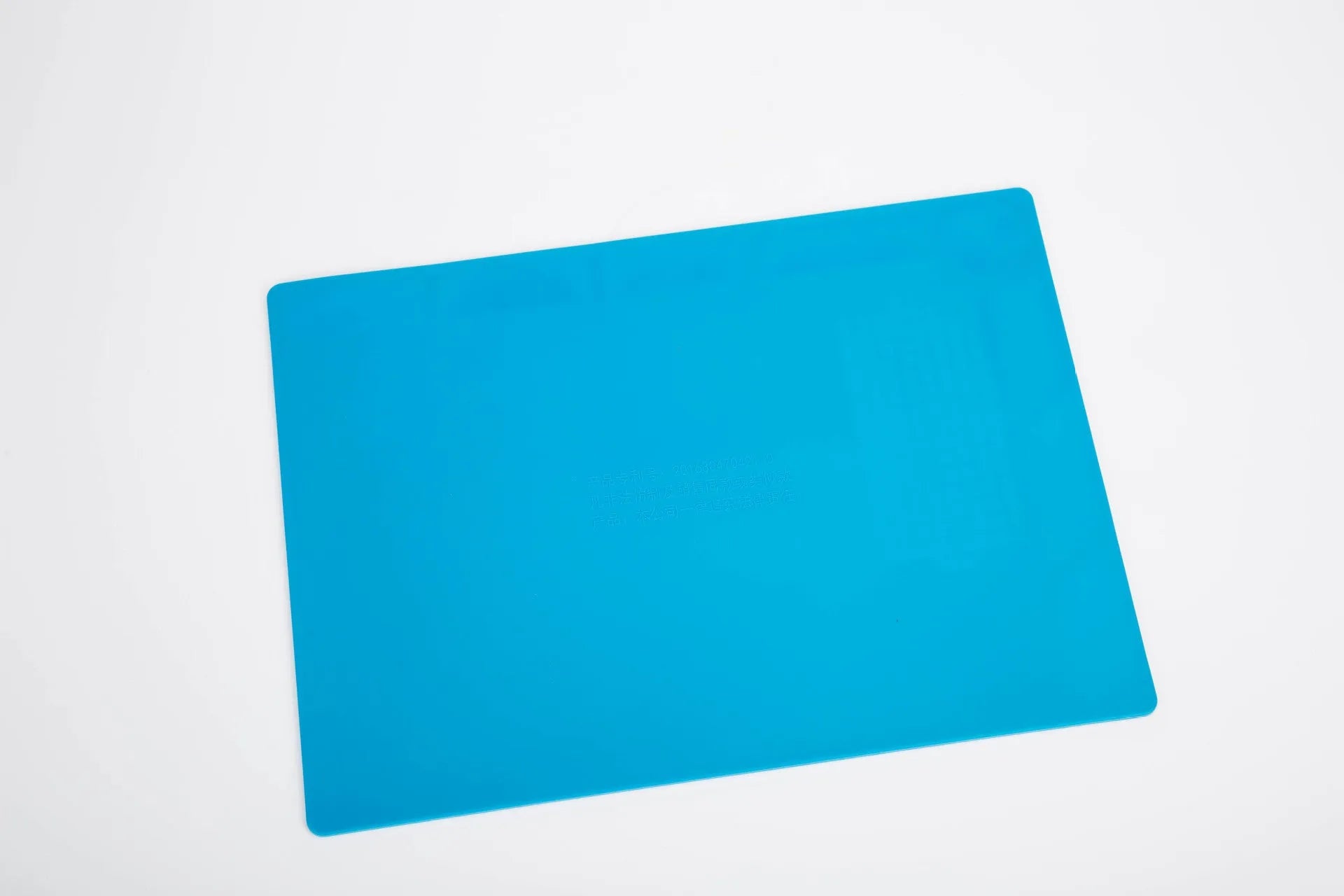 Blue silicone watch repair anti-skid mat for non-slip work surface during watch maintenance