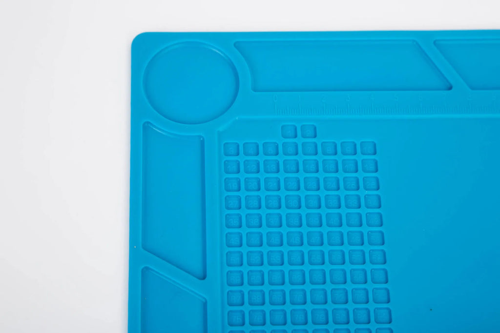 Blue silicone watch repair anti-skid mat for non-slip work surface during watch maintenance