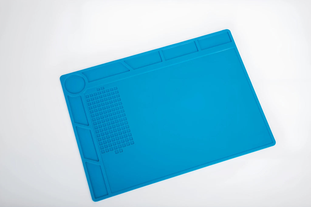 Blue silicone watch repair anti-skid mat for non-slip work surface during watch maintenance