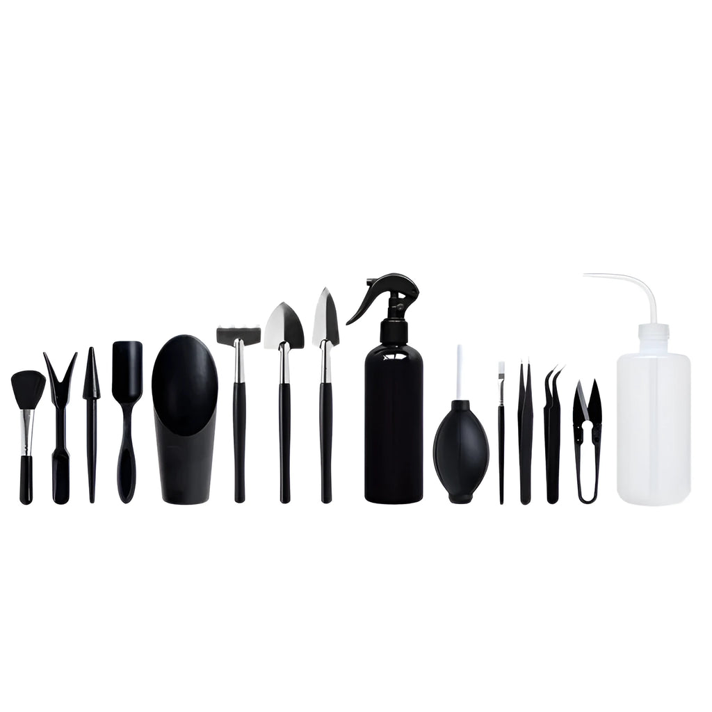 Black mini succulent garden tool set with 14 pieces including tweezers, shovel, spray bottle, and a square cushion laid out.