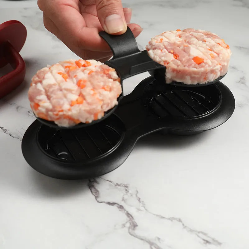 Black and red burger press mould with oil paper liners for making patties