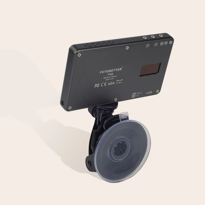 Black portable LED video light for laptop with display screen and USB-C port, shown mounted on a tripod.