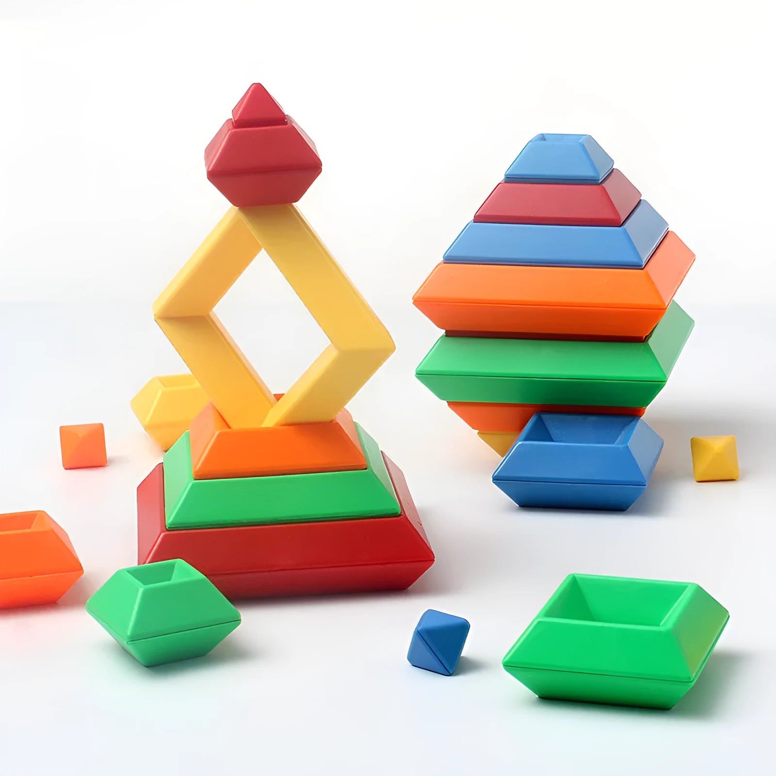 Rainbow coloured plastic building blocks forming educational towers for children's cognitive development