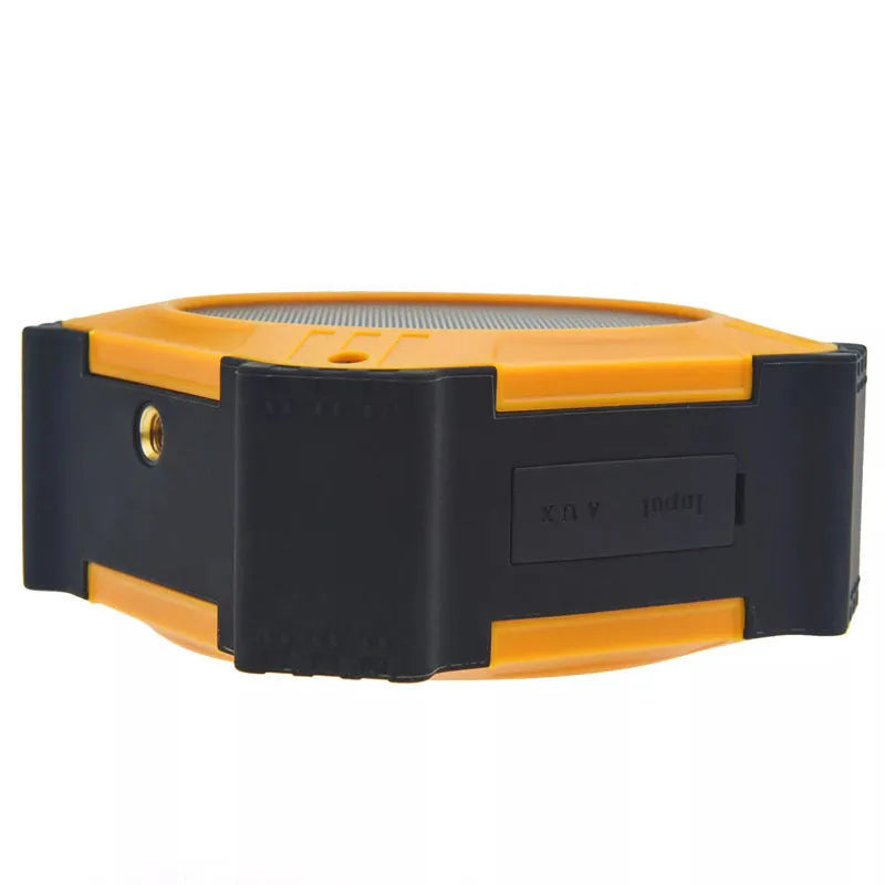Compact waterproof Bluetooth speaker with wrist strap for outdoor use