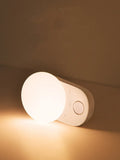 White rechargeable night light with motion sensor for bedside use