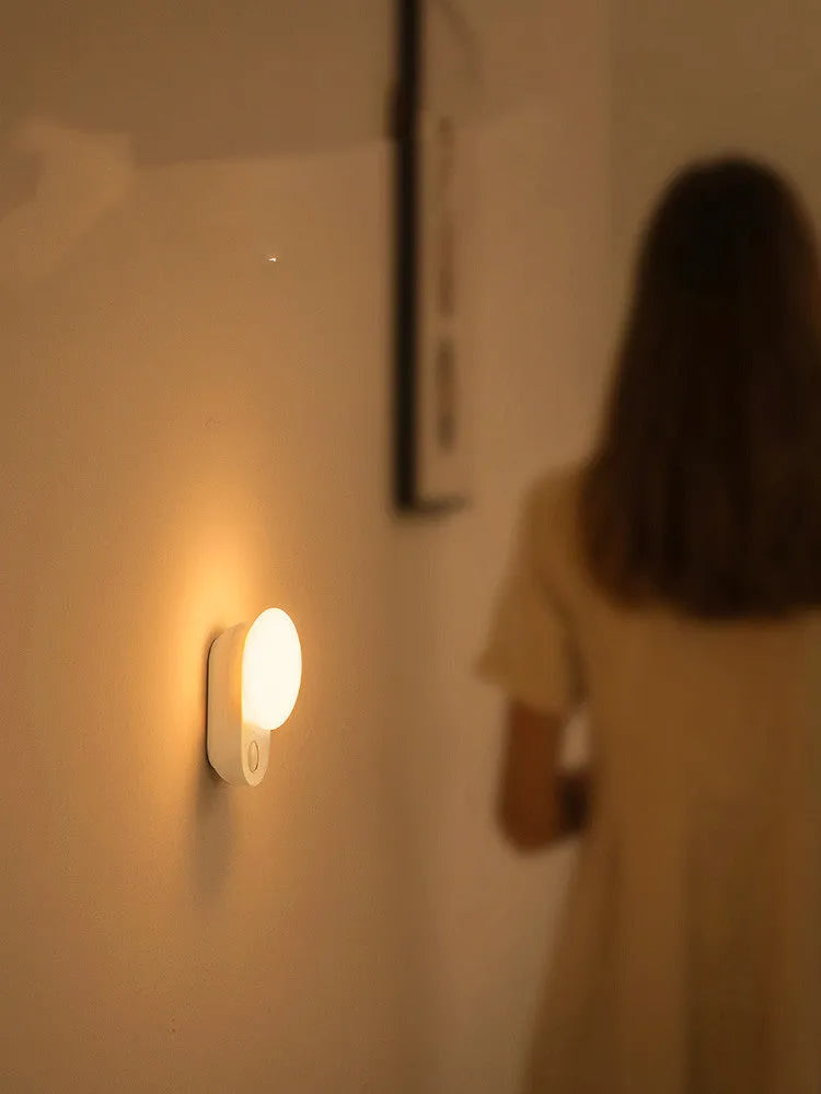 White rechargeable night light with motion sensor for bedside use
