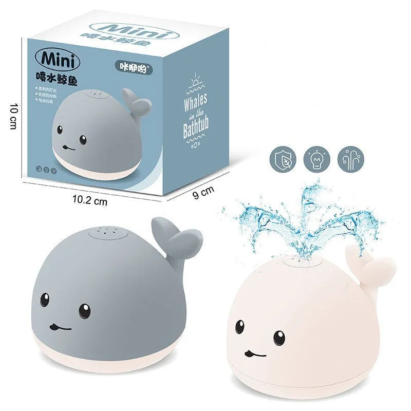 Grey whale bath toy spraying water with LED lights in baby bath