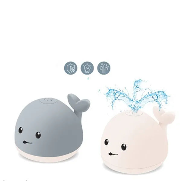 Grey whale bath toy spraying water with LED lights in baby bath