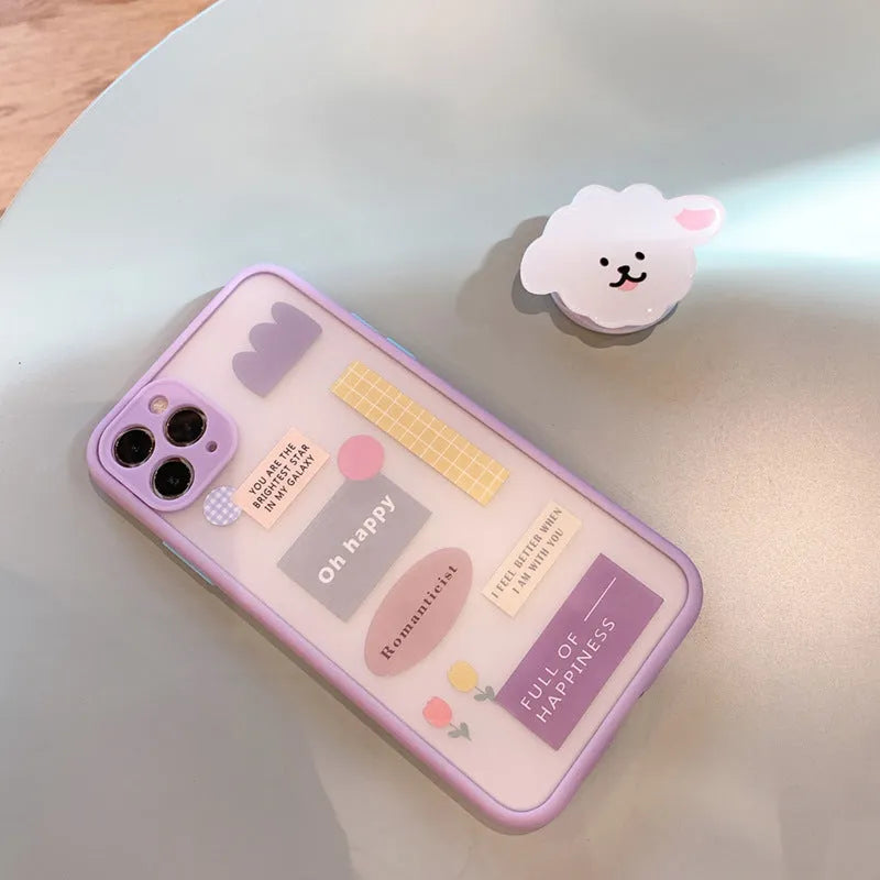 Frosted painted TPU mobile phone case with integrated folding bracket, shown in a cartoon design for iPhone.