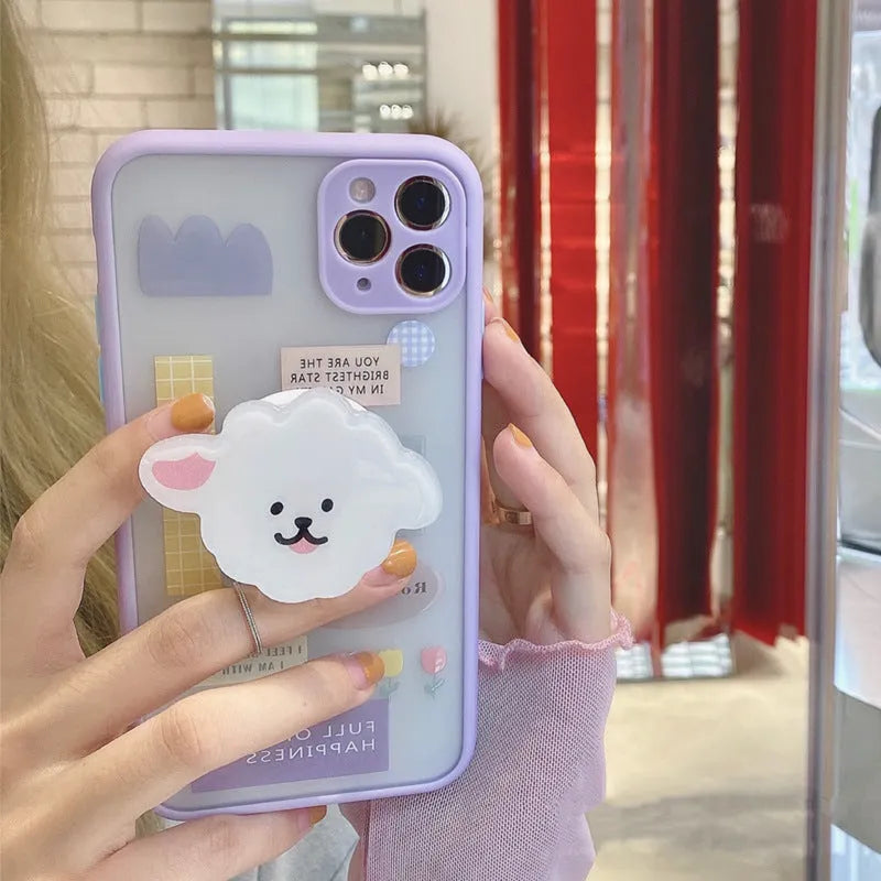 Frosted painted TPU mobile phone case with integrated folding bracket, shown in a cartoon design for iPhone.
