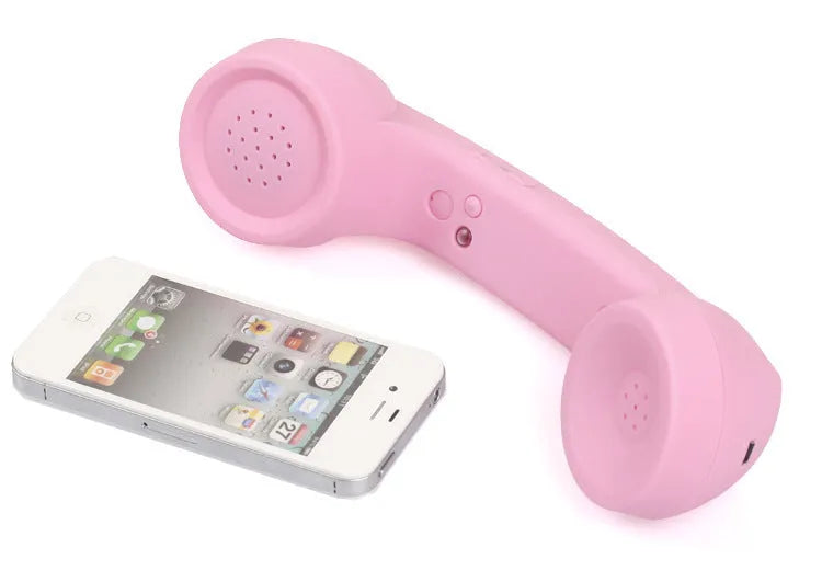 Retro-style Bluetooth wireless headset with microphone in multiple colour options showing hanging-ear design