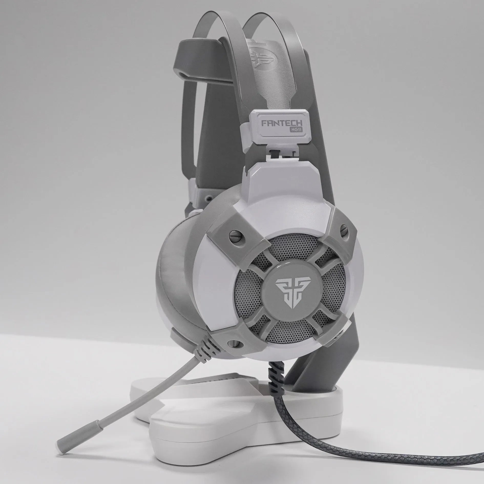 Black FANTECH HG11 over-ear USB gaming headset with RGB lights on the ear cups.