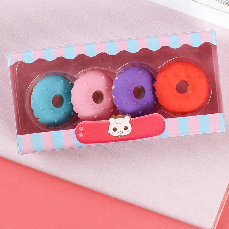 Pack of 12 cartoon food-themed erasers for children, showing cone, ice cream, and lollipop designs.