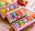 Pack of 12 cartoon food-themed erasers for children, showing cone, ice cream, and lollipop designs.