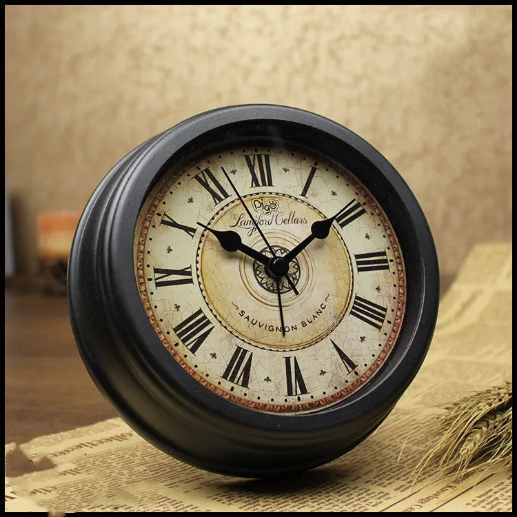 European retro style round desk clock with silent alarm on wooden table