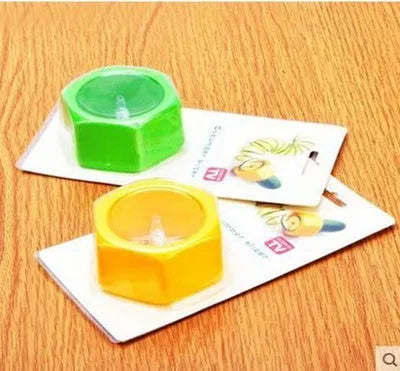 Yellow and green spiral vegetable cutter kitchen tool made from food-grade plastic.