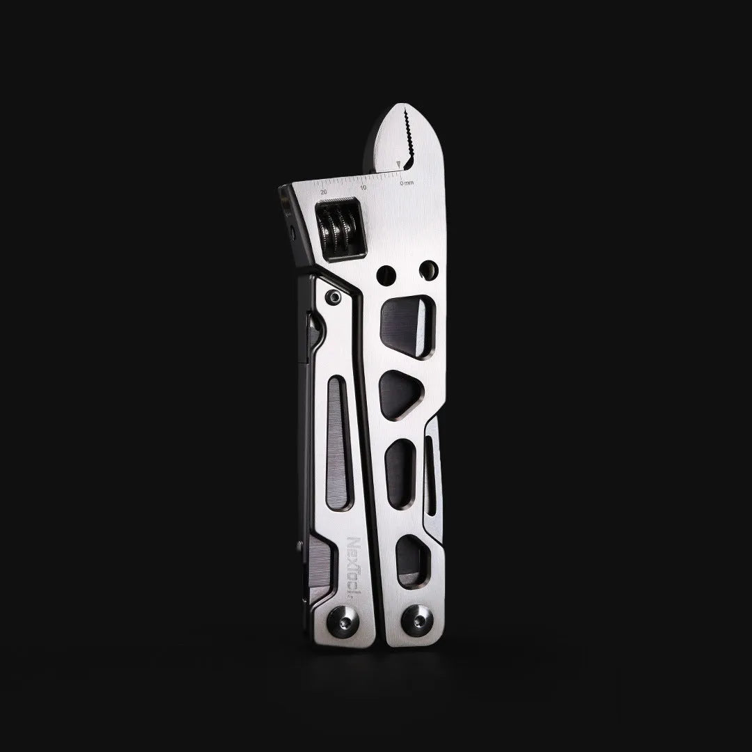 White stainless steel multi-function tool combining a wrench, knife, and needle-nose pliers
